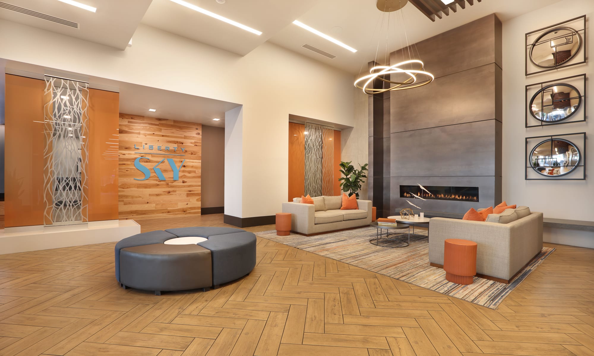 Lobby with fireplace, chandelier and sofas at Luxury high-rise community of Liberty SKY in Salt Lake City, Utah 