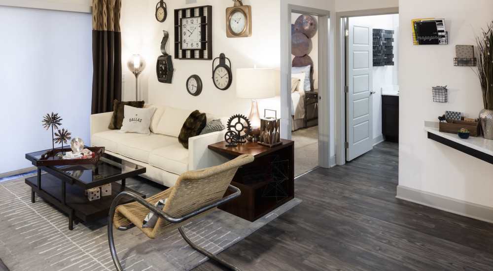 Bright living room with couch, coffee table at Pike West Commerce in Dallas, Texas