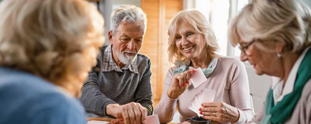 Residents playing cards at Peaks at Millcreek in Salt Lake City, Utah