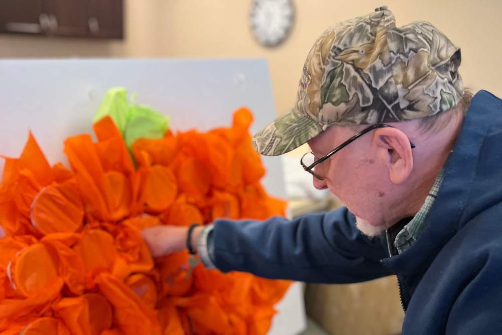 Resident creating a piece of art at Legacy Living Defiance in Defiance, Ohio