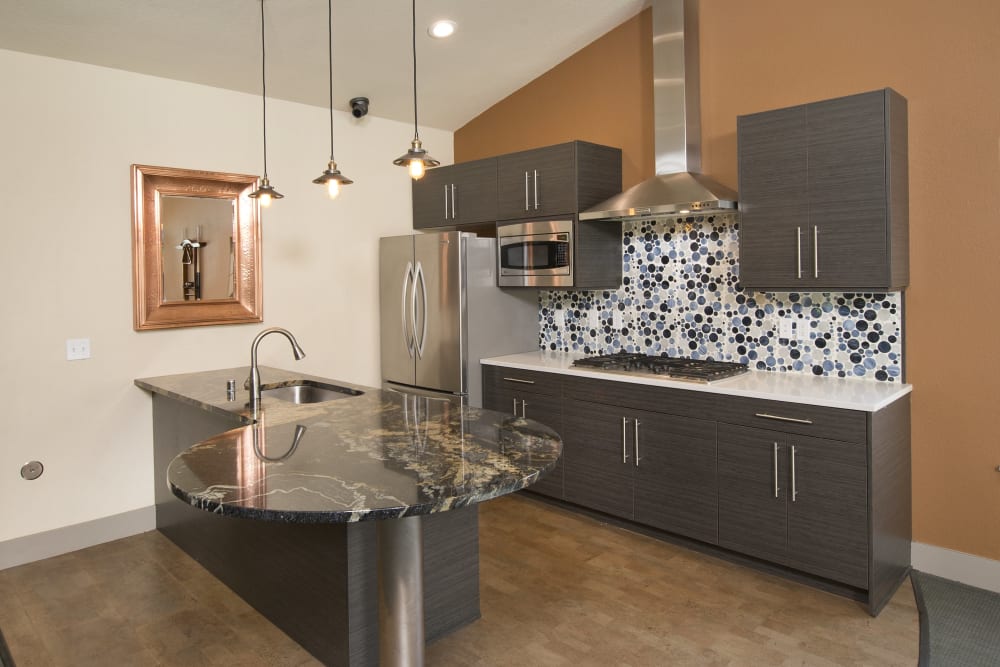 Clubhouse community kitchen for entertaining guests at Slate Ridge at Fisher's Landing Apartment Homes in Vancouver, Washington