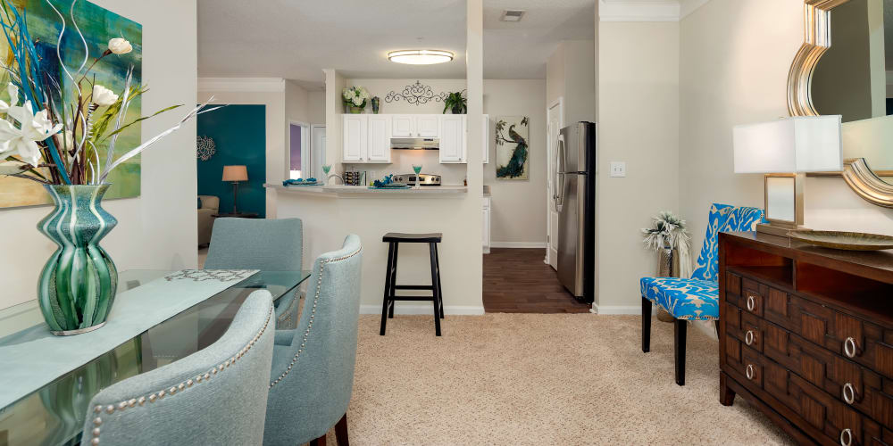 Dining area and kitchen with bar seating at City Harbor in Melbourne, Florida