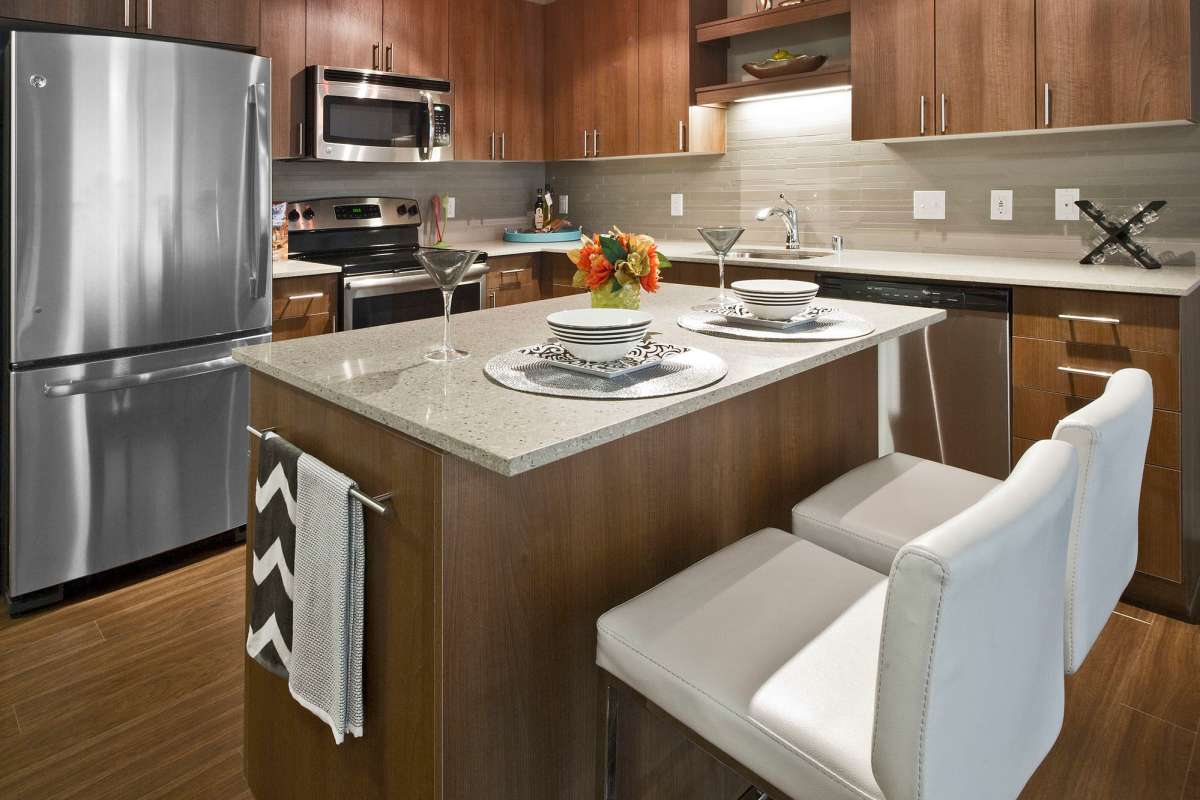 Kitchen with an island at Astro Apartments in Seattle, Washington