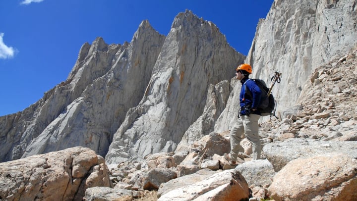 A man hiking up in the mountains