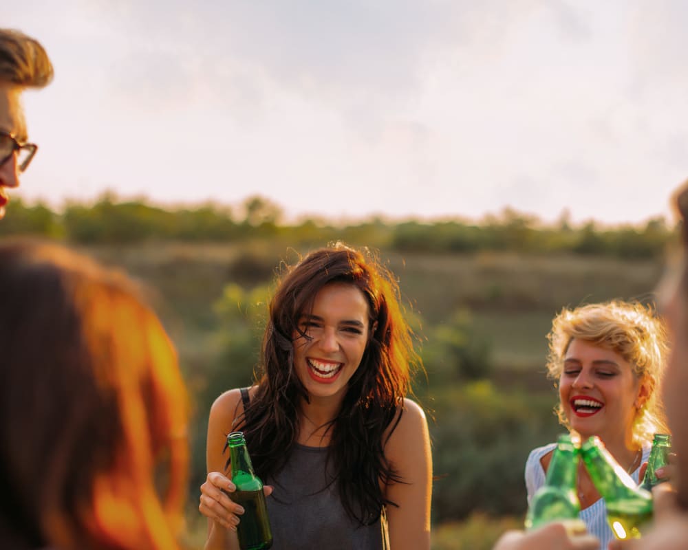 Residents enjoying a beverage on a sunny afternoon at Sofi Belmont Hills in Belmont, California