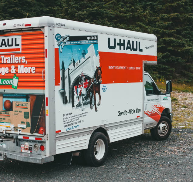a back corner view of a 10 foot u-haul box truck parked in a parking lot