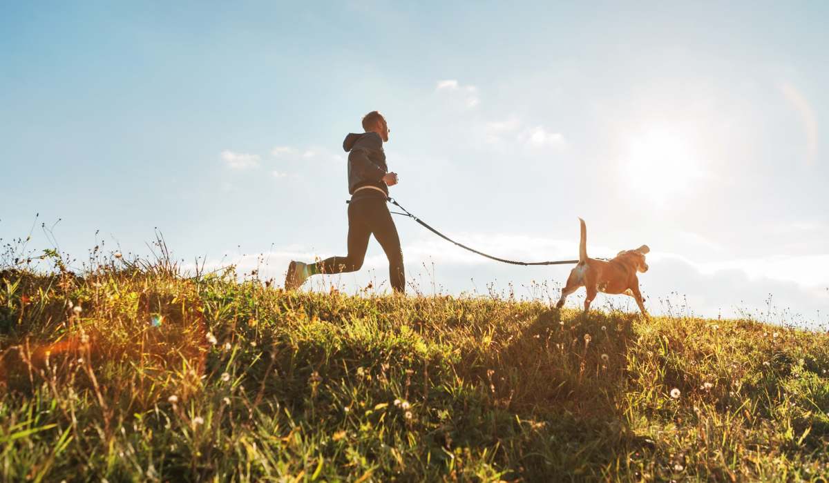 Resident running with his dog at Ventura Park Plaza Apartments in Portland, Oregon