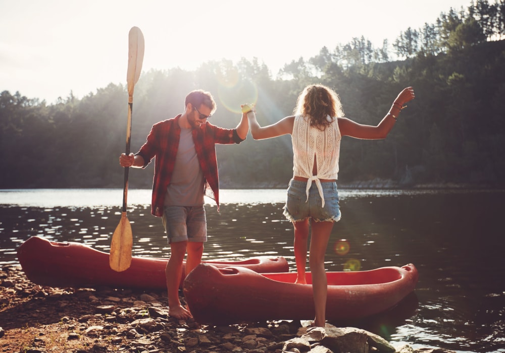 Couple getting into their kayaks on the river near Woodrum Manor/Westview in Pearisburg, Virginia