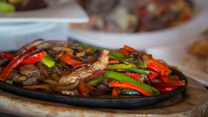 Plate of fajitas at a local Mexican restaurant near Olympus Midtown in Nashville, Tennessee