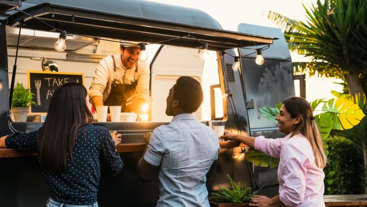 A group of young people ordering at a food truck in Jacksonville.