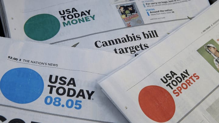 Several overlapping USA Today newspaper sections