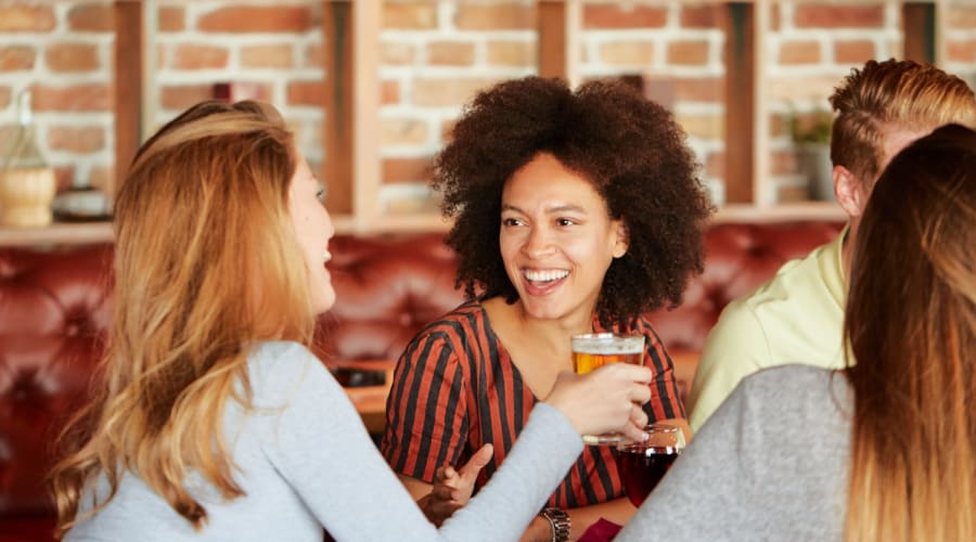 Friends enjoying some beverages at Austell Village Apartment Homes in Austell, Georgia