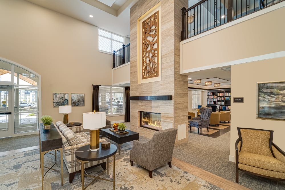 Entry lounge with fireplace at Applewood Pointe of Eden Prairie in Eden Prairie, Minnesota. 