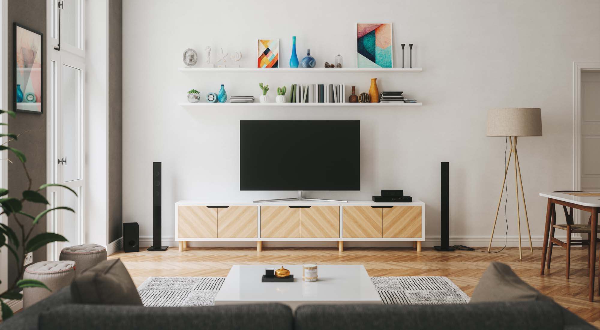 Fully furnished living room with a TV and floor standing speakers at Baywoods in Antioch, California   