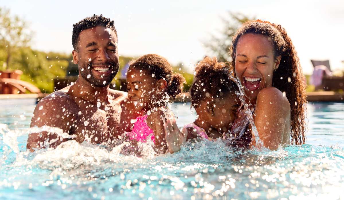 Happy family in a pool at The Heights at Waterpointe in Flowood, Mississippi