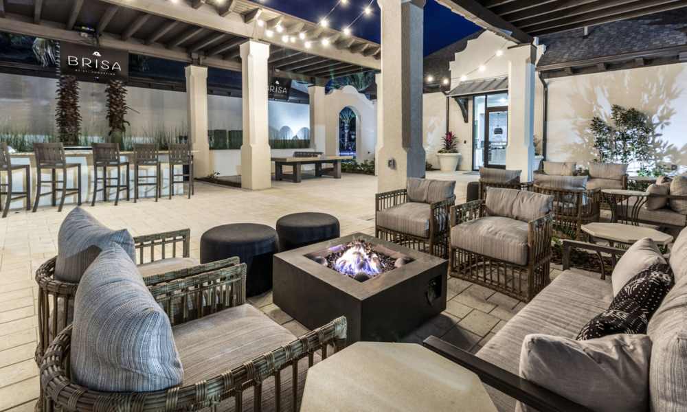 Outdoor seating area with fire pits and sofas at Brisa at St. Augustine in St. Augustine, Florida