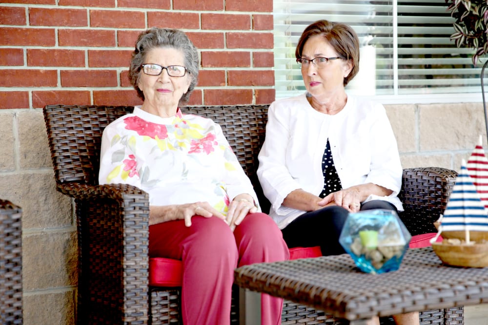 Residents sitting outside at Providence Assisted Living.