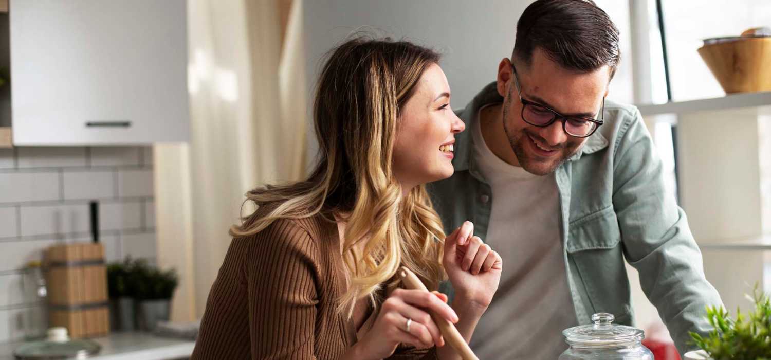Happy couple in apartment kitchen at Heritage Manor in Mineral Wells, Texas
