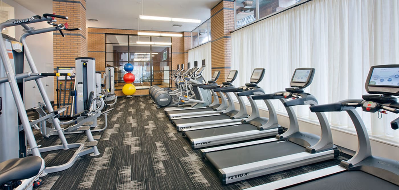 Fitness center with treadmills at 21 West Street in New York, New York