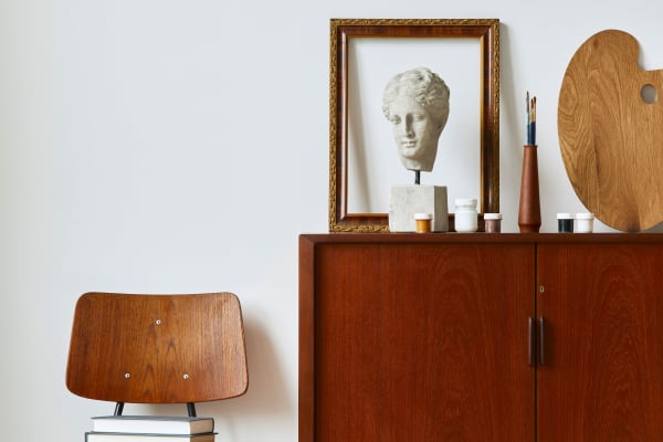 Retro-modern furniture and classic decor in a model home's living area at The Fitz Apartments in Dallas, Texas