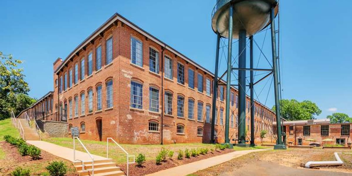 A beautiful, brick apartment building managed by Saratoga Capital Partners