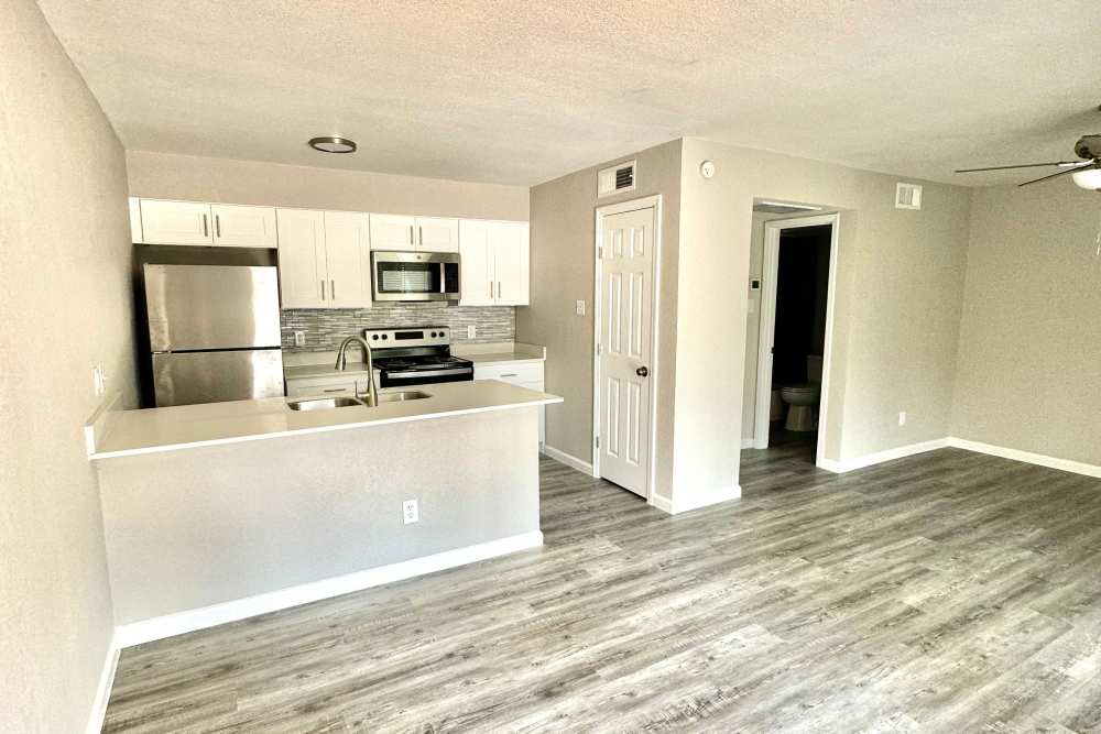 View of kitchen from living room at Athena Garden Apartments in Athens, Texas