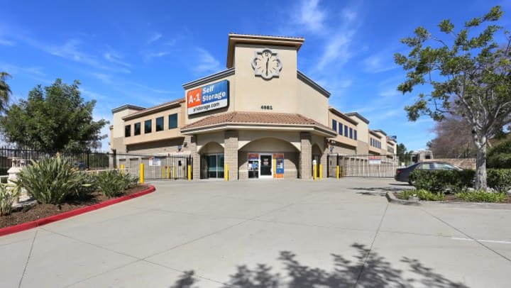 A view up to the front entrance of A-1 Self Storage on Spring St in La Mesa, CA, including the clock above the front office.