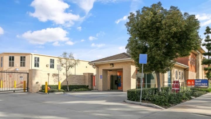 The front entrance to A-1 Self Storage in Cypress, CA, has space for several vehicles to park, in addition to the gate into the rest of the facility.
