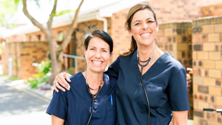 Two woman smiling