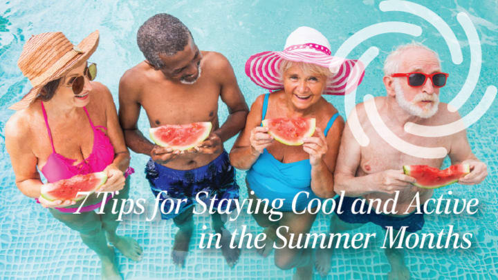 Happy senior residents standing in a pool together eating watermelon
