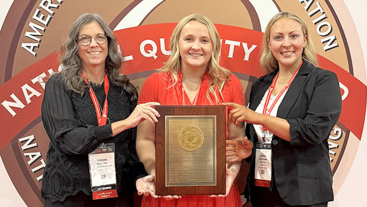 Fair Oaks and Holton Manor leadership staff hold the National Bronze Quality Award won by each facility.