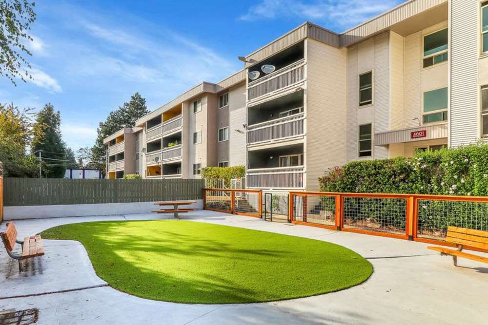 Exterior view of an apartment with seating space at Lantera Apartments in Seattle, Washington