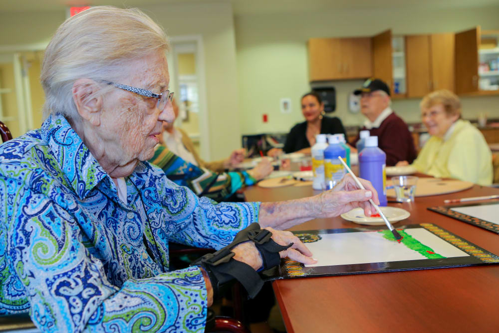 A resident painting at Harmony at Chantilly in Herndon, Virginia