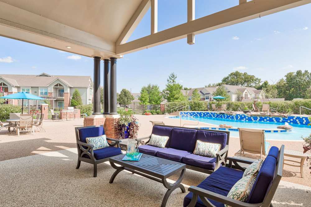 Seating area beside the swimming pool at Eastland Trails in Independence, Missouri