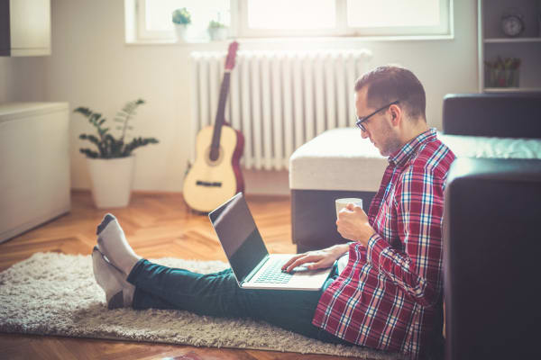 Man enjoying his apartment at Fifteen15 in Calgary
