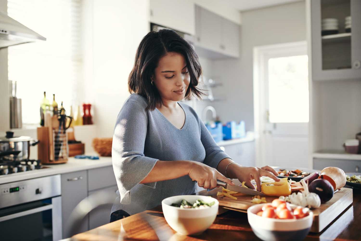 Resident in kitchen at Country Manor Apartment Homes in Webster, New York