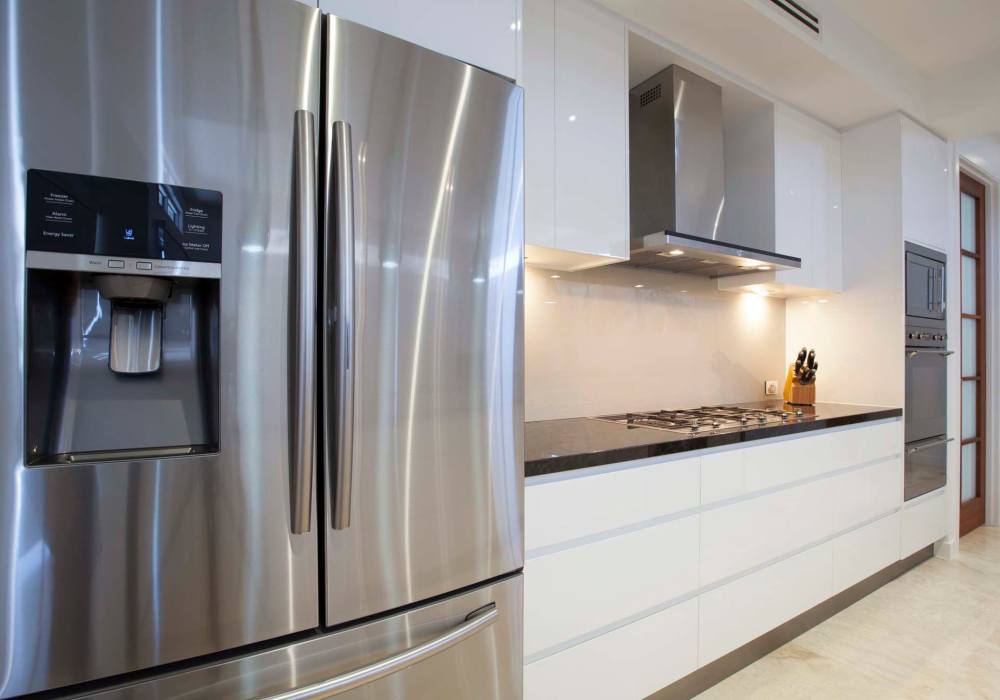  Kitchen with electric stove cooktop at Athens Vista Senior Apartments in Los Angeles, California