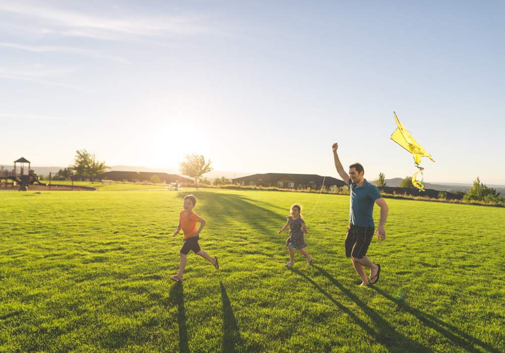Father and his two kids playing in the park near Cadillac Flats in Napa, California