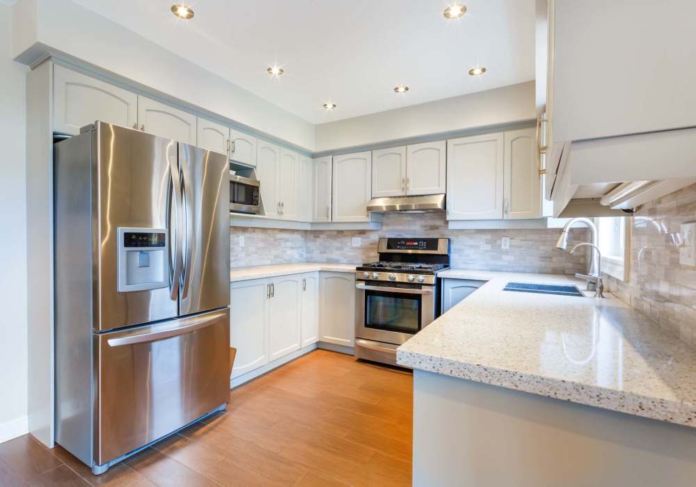 Kitchen with wood flooring at Village on Wiley in Jacksonville, Florida