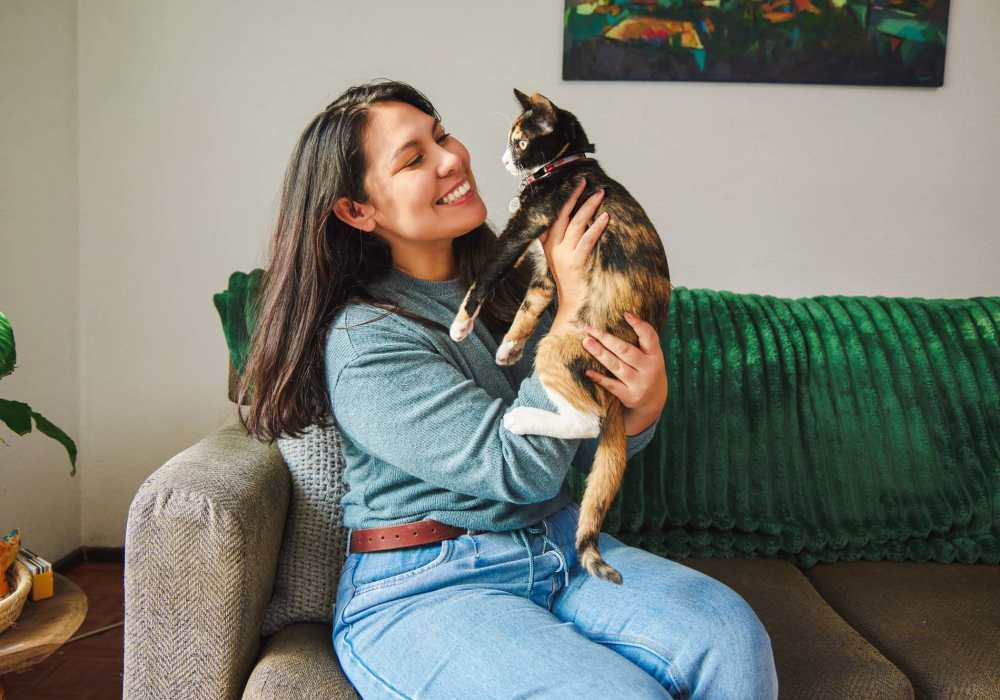 Resident playing with her cat at Park Hacienda Apartments in Pleasanton, California