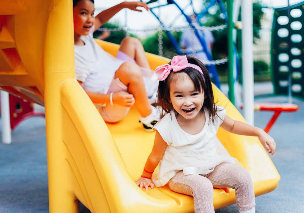 Kids playing on the slide in park near Casa Santa Fe Apartments in Scottsdale, Arizona 