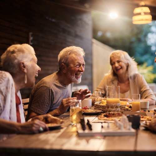 Group of residents dining at Fullerton, California near UCE Apartment Homes