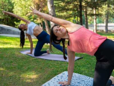 Residents doing yoga in the park near St. Michael's Apartments in Riverside, California