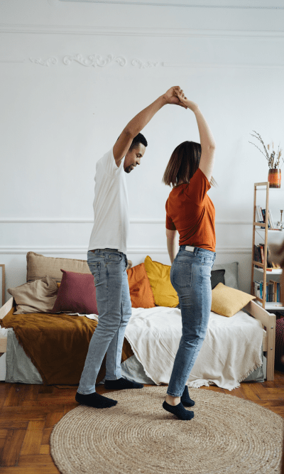 Couple dancing in their living room at Brittwood Apartments in Columbus, Georgia