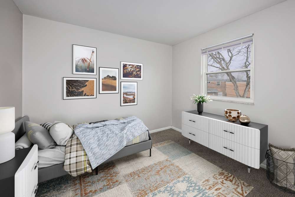 Cozy bedroom with large window at Eden Brooke Townhomes in Columbus, Ohio,