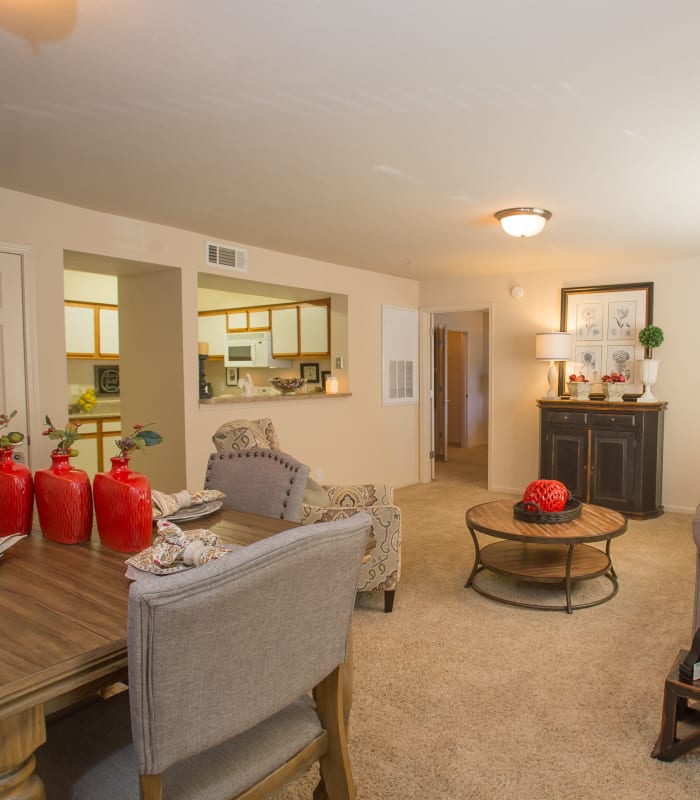 Open dining room and living room with view of kitchen at Villas at Stonebridge in Edmond, Oklahoma