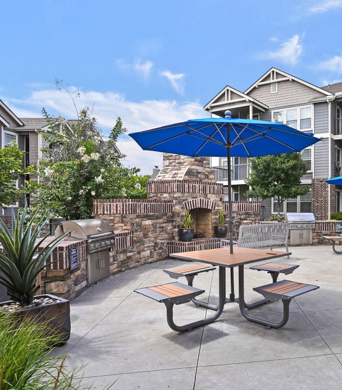 Outdoor grill area at Cottages at Tallgrass Point Apartments in Owasso, Oklahoma