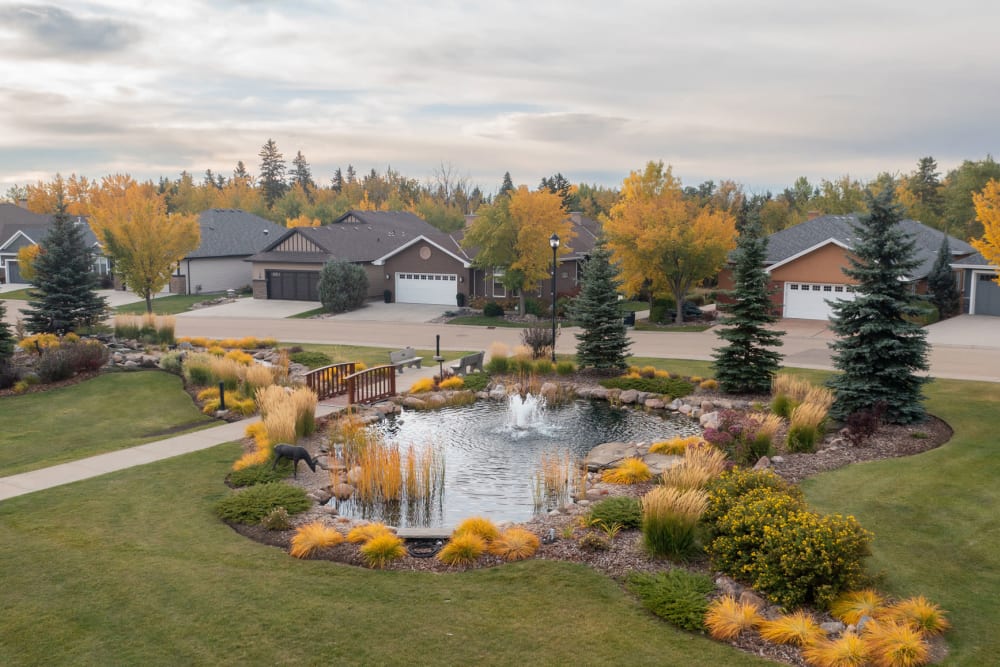 Neighborhood with pond at Touchmark at Wedgewood in Edmonton, Alberta