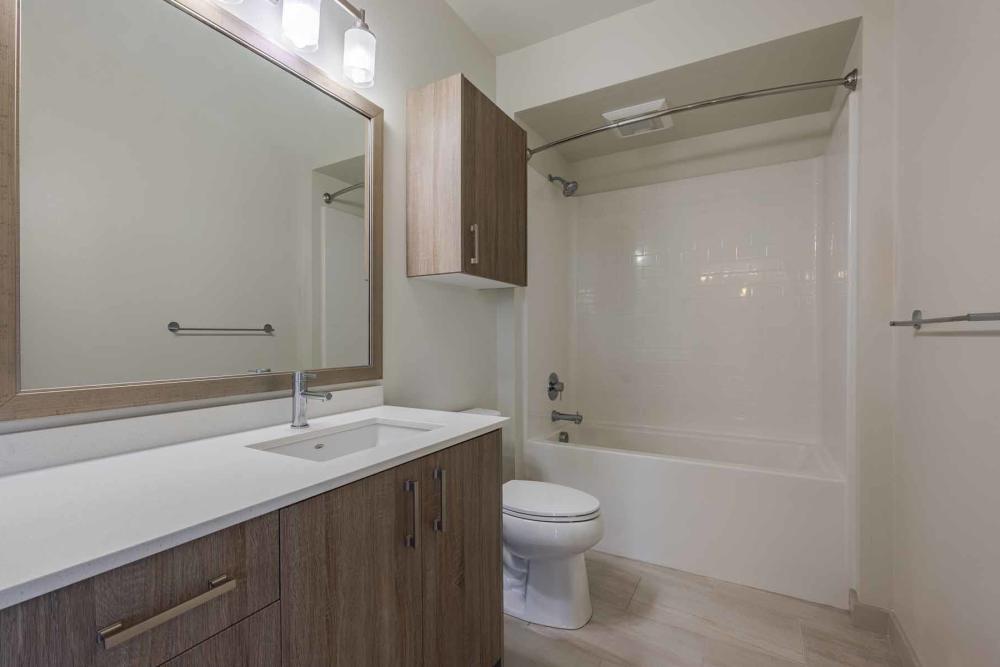 Modern bathroom with large tub at ArLo Apartments in Portland, Oregon