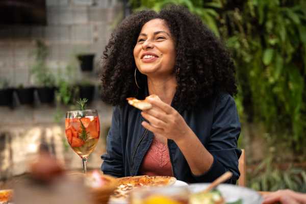 Resident enjoying a meal and drink at a local restaurant near Eagle Ridge Circle in Rochester, New York